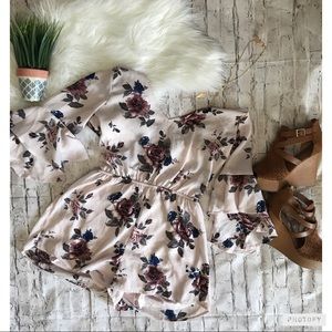 Beautiful floral romper with 1/2 bell sleeves